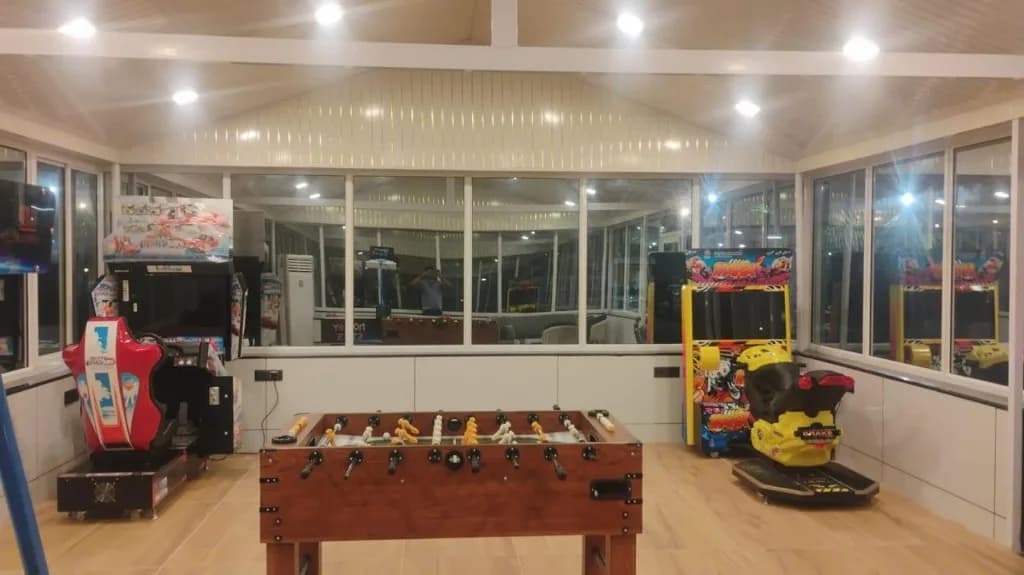 Indoor arcade with foosball and racing games at Motus