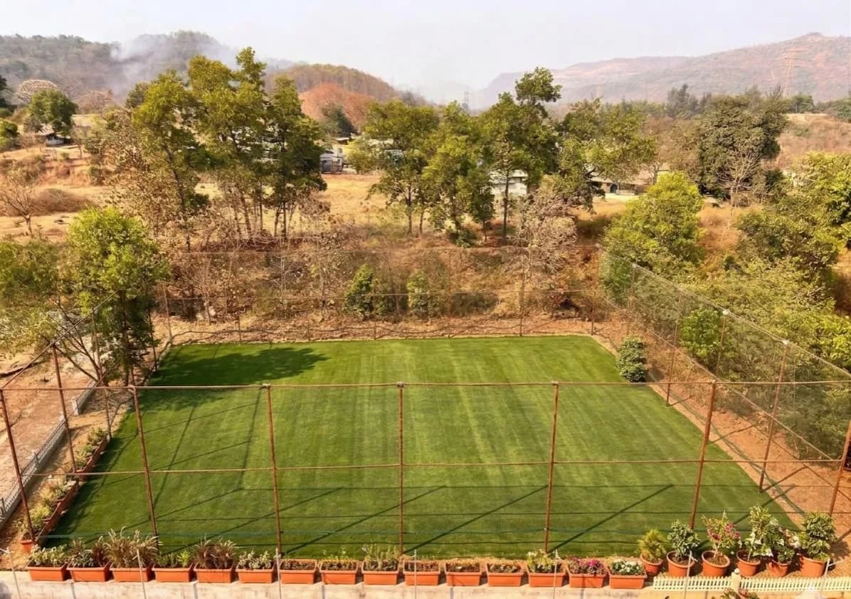 Lush green turf overlooking the Sahyadri hills near the hotel