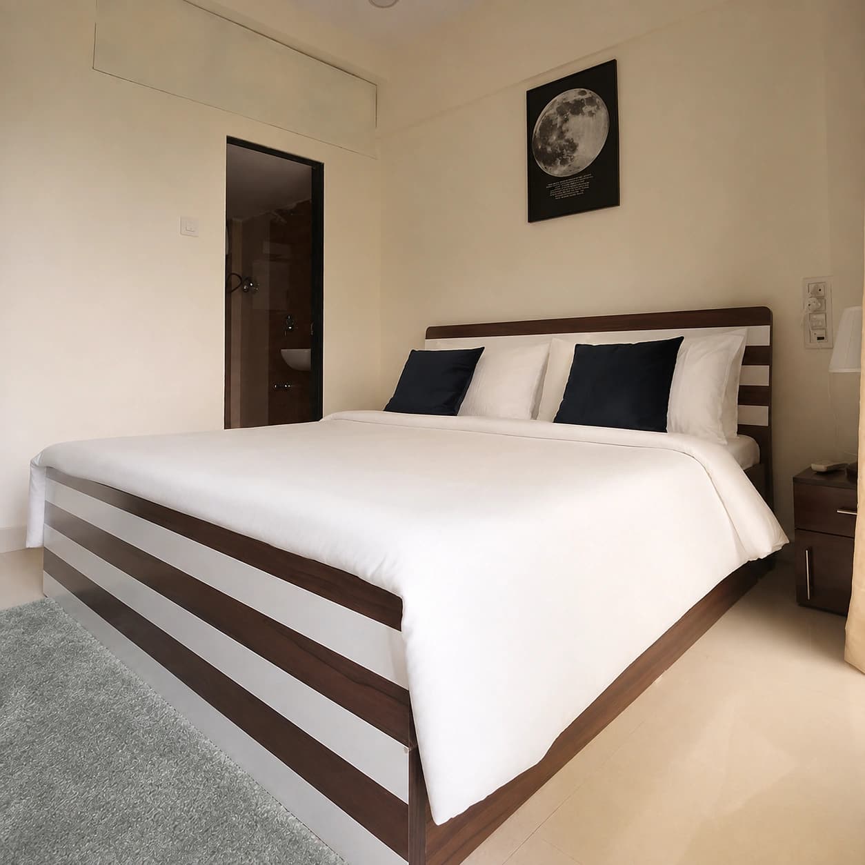 Deluxe Double Room: Deluxe double bed with ensuite bathroom beyond the doorway