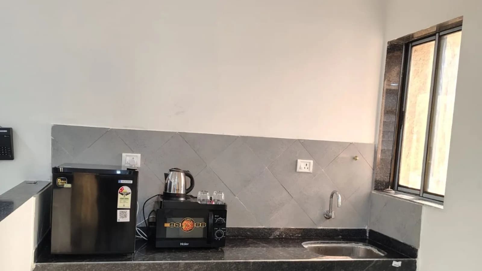 Residence suite kitchenette with kettle, microwave and mini fridge