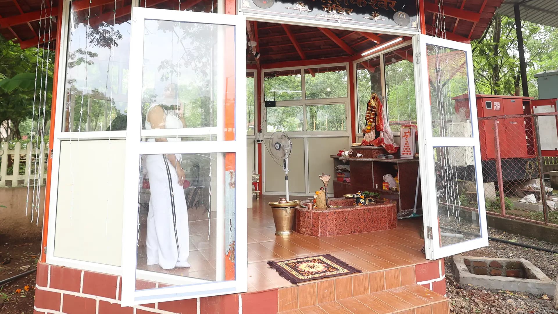 On-site temple surrounded by greenery at Motus